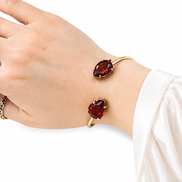 Luxury 18K Gold Open Cuff Bracelet with Red Gemstones.
